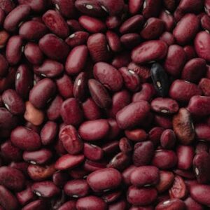 A detailed close-up of red kidney beans, showcasing texture and color. Perfect for food and agriculture themes.